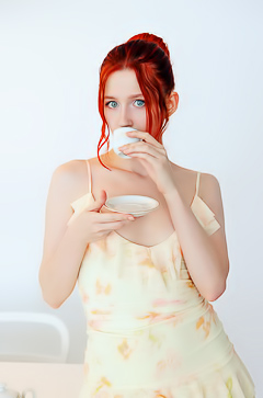 Alice Teasingly Drapes This Up-Do With Latex On The Couch In Bedroom